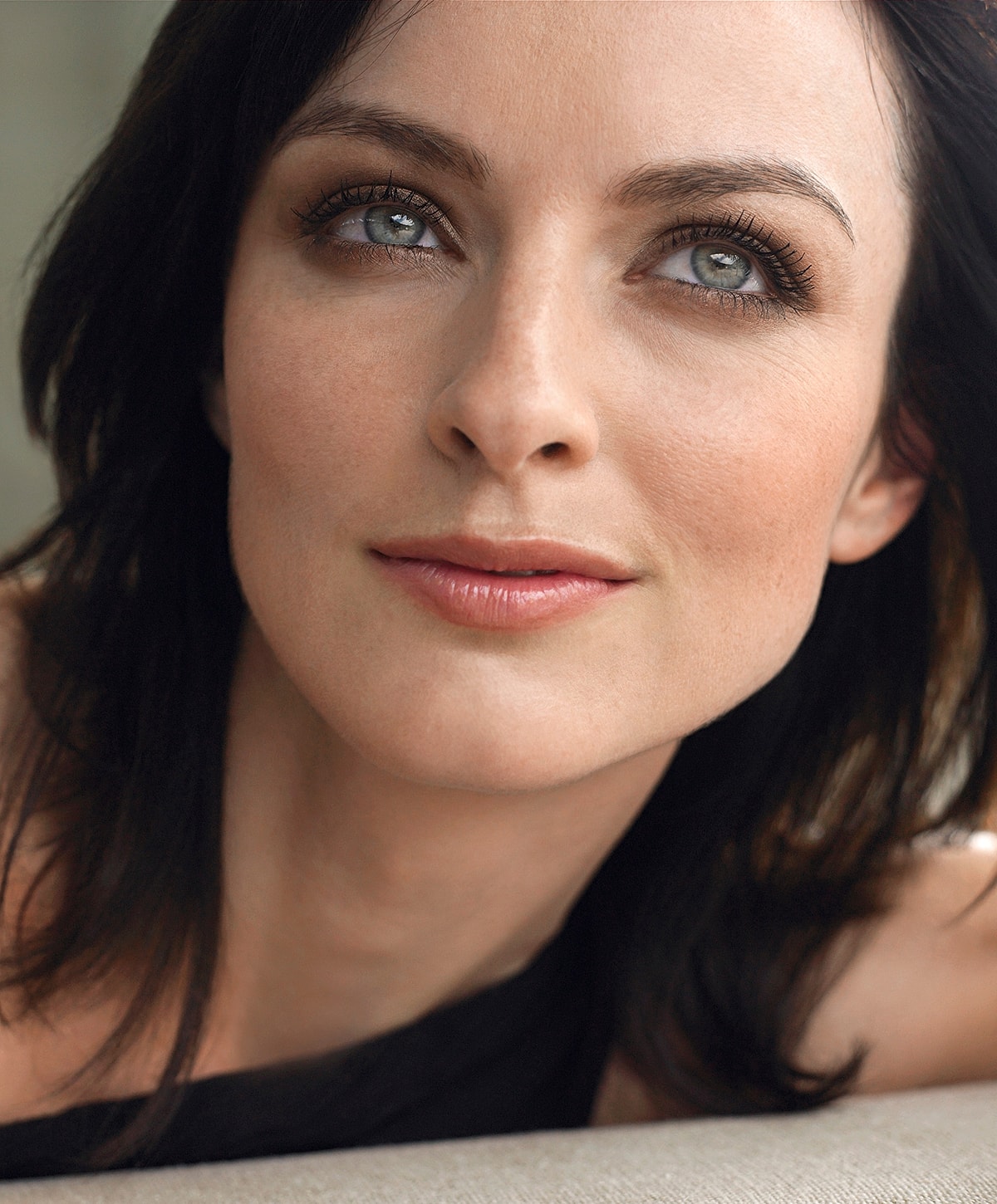 Close-up portrait of a woman with dark hair.