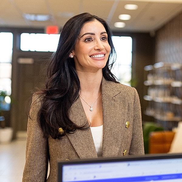 St. Louis Med Spa patient holding syringe in clinic setting.
