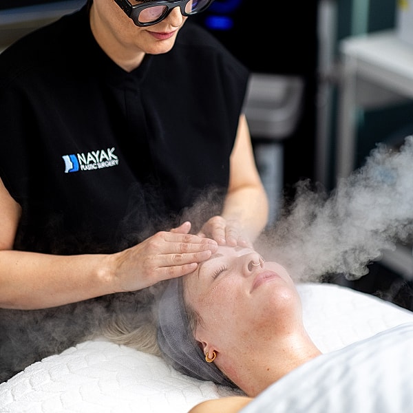 St. Louis MedSpa professional holding syringe in clinic setting.