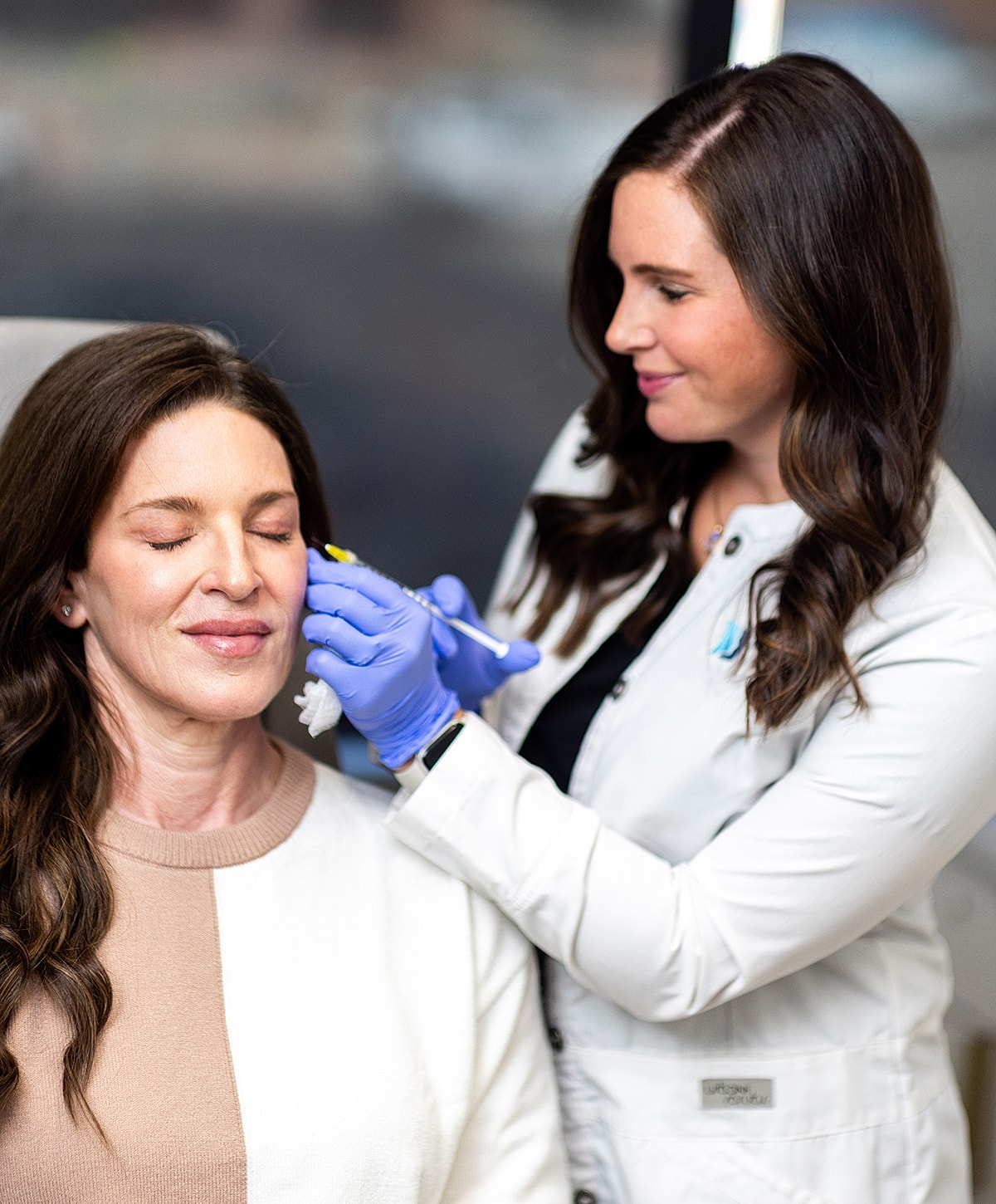 St. Louis Dysport provider gently touching patient face.