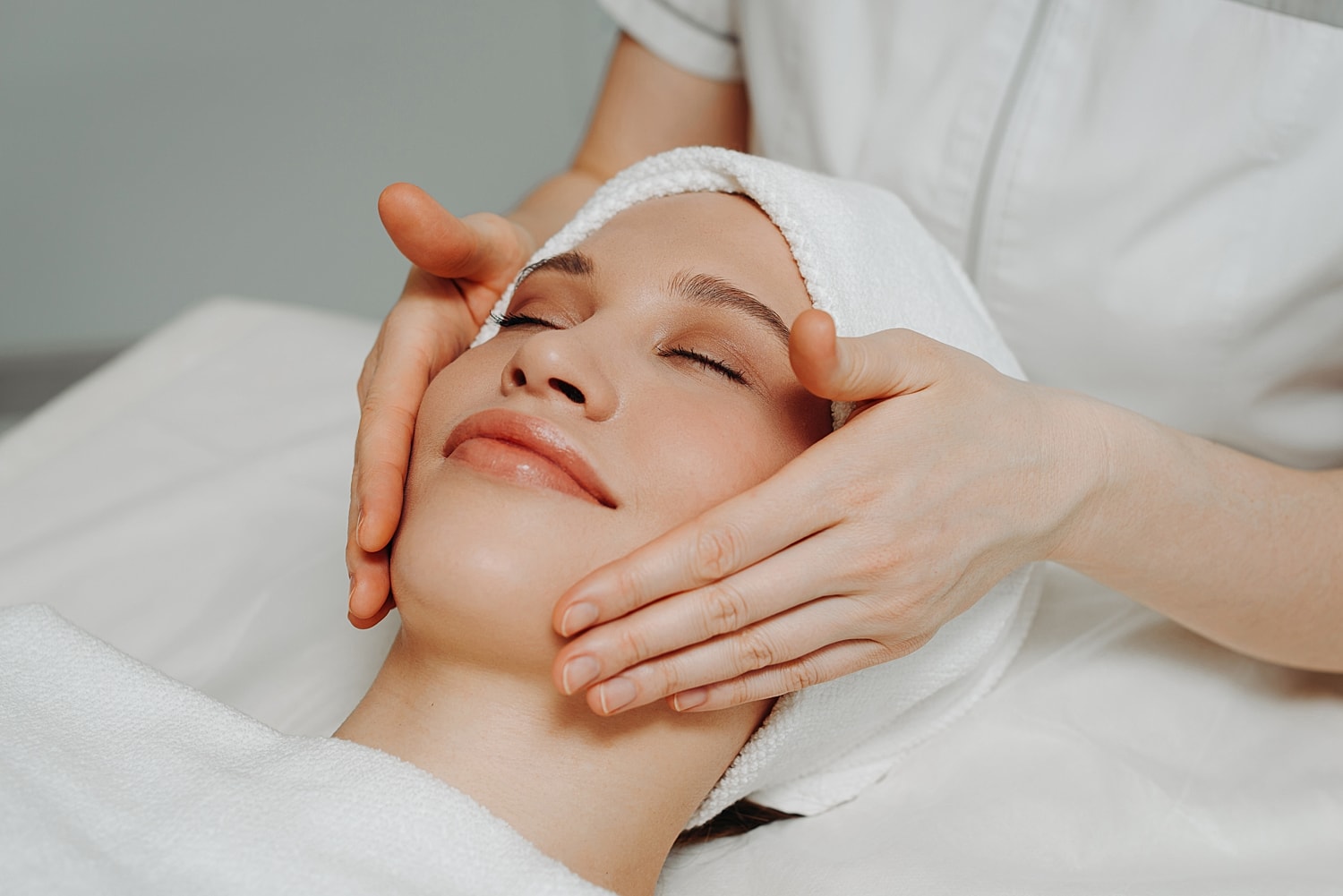 Facial treatment with gentle massage and relaxation.