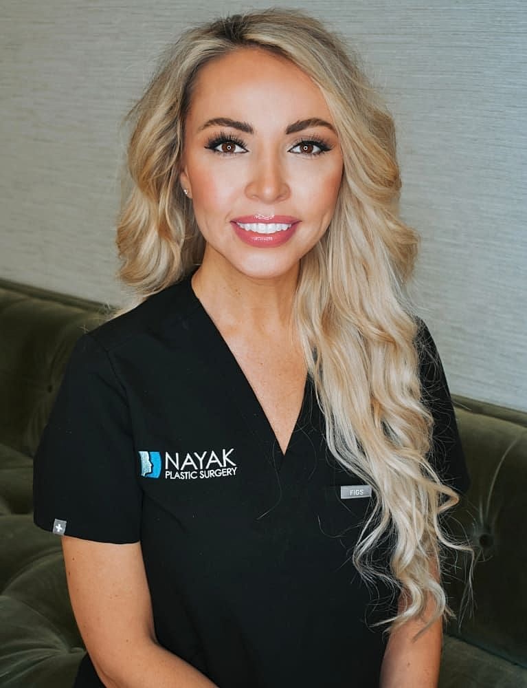 Healthcare professional in plastic surgery attire.