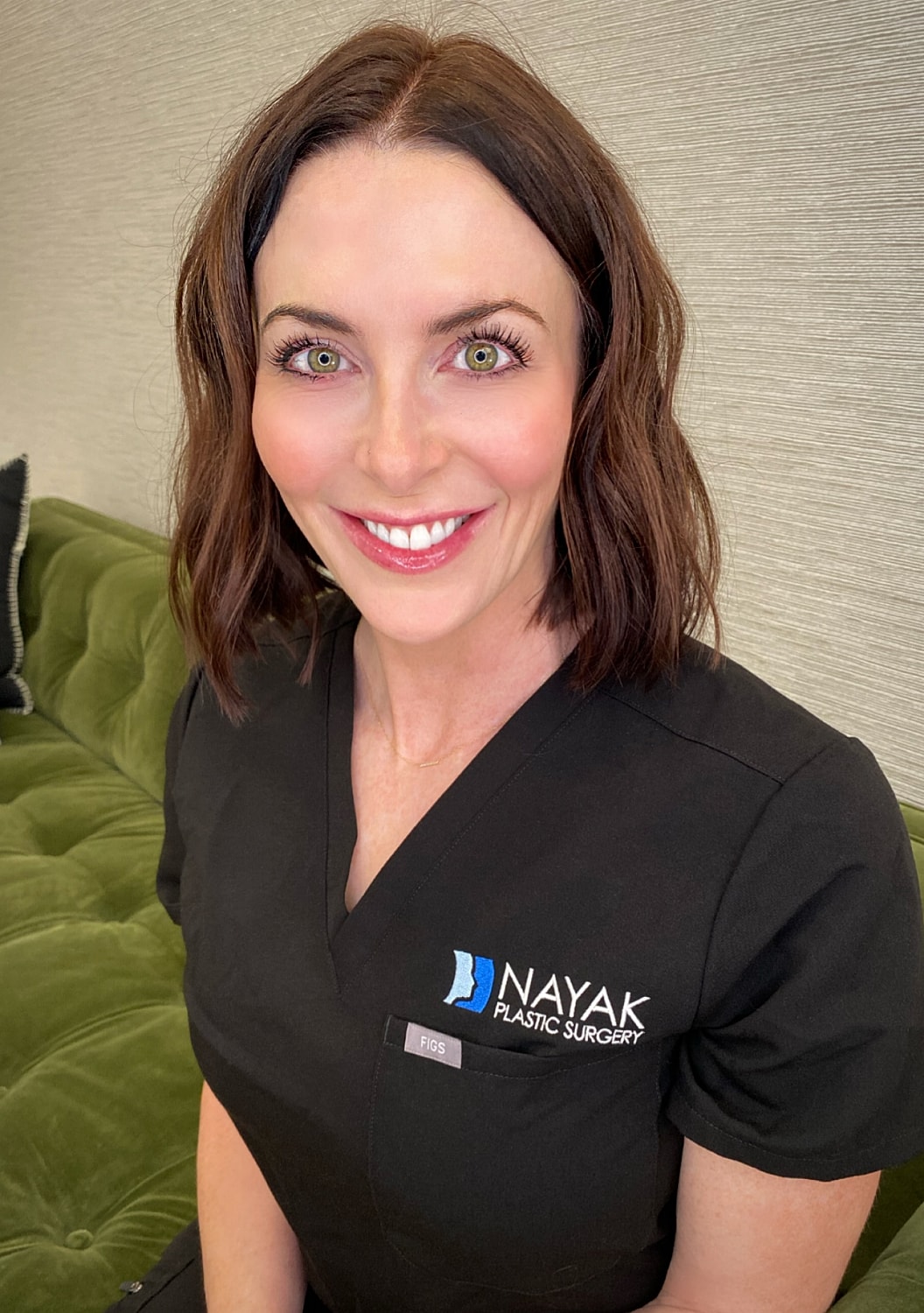 Sarah S smiling in professional attire.