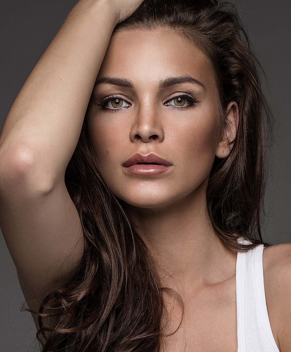 Close-up portrait of a woman with dark hair.