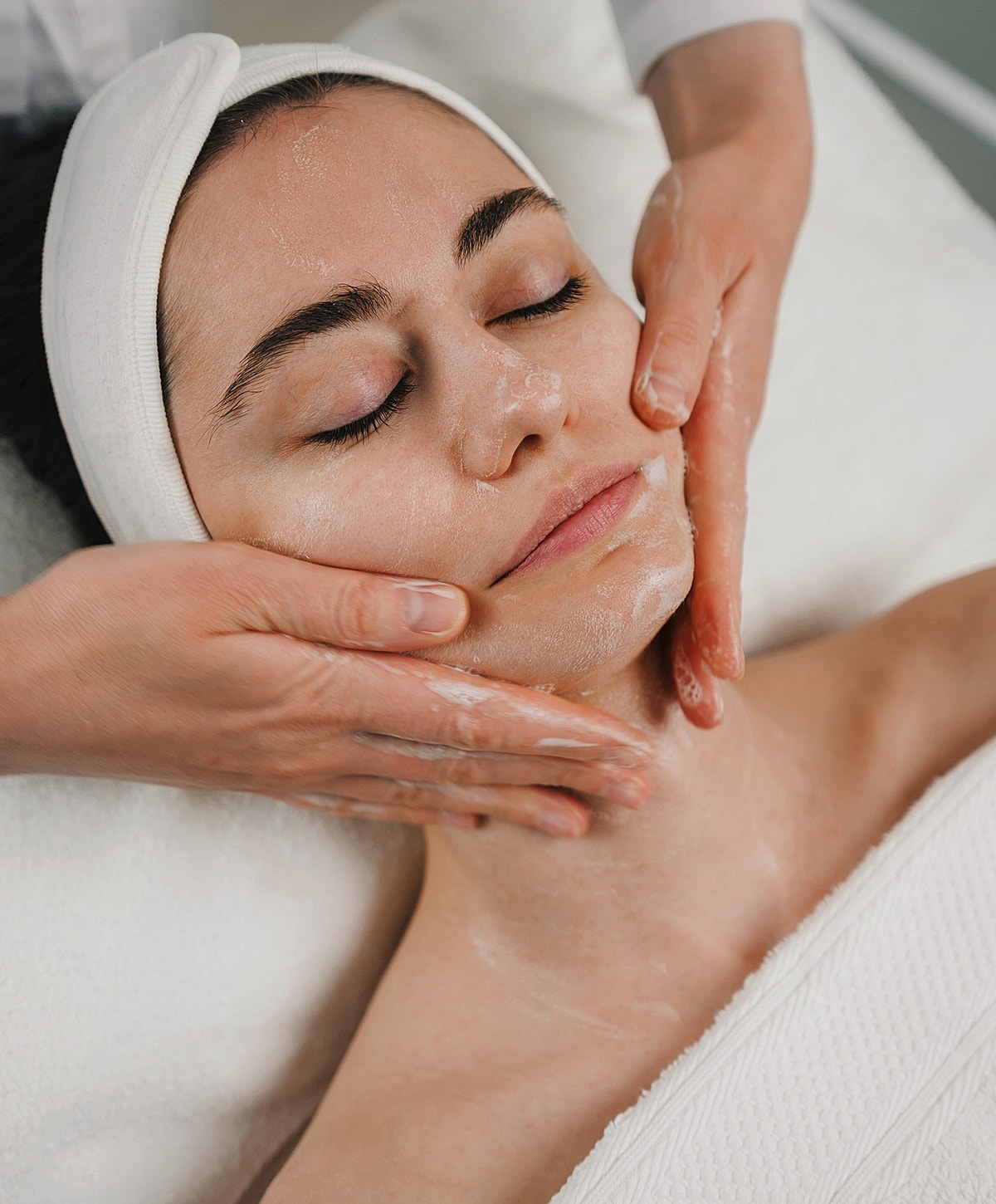 St. Louis Medical Grade Skincare model receiving treatment in a spa setting.